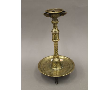 A Persian brass oil lamp. 30 cm high.