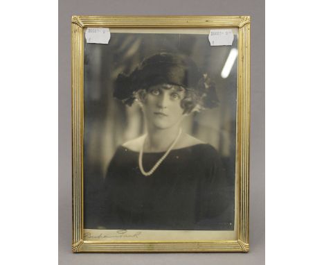 A  vintage photograph of a young lady by Bertram Park, signed beneath, framed and glazed. 16 x 22 cm.