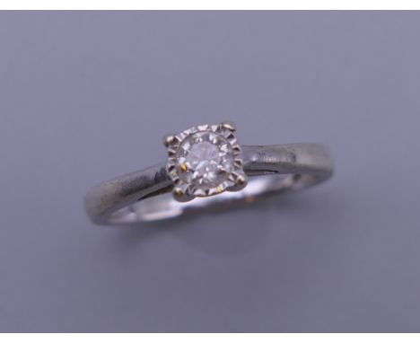 A white gold diamond solitaire ring, the stone approximately 0.25 carats. Ring size K/L. 1.9 grammes total weight.