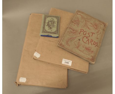 Three vintage postcard albums