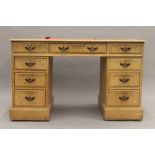 An Edwardian oak twin pedestal desk. 121 cm wide.