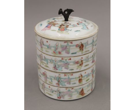 A 19th century Chinese four section porcelain food box. 16 cm high.