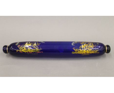 A Victorian Bristol blue glass rolling pin, decorated with ships. 38 cm long.