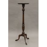 A modern mahogany torchere. 106.5 cm high.