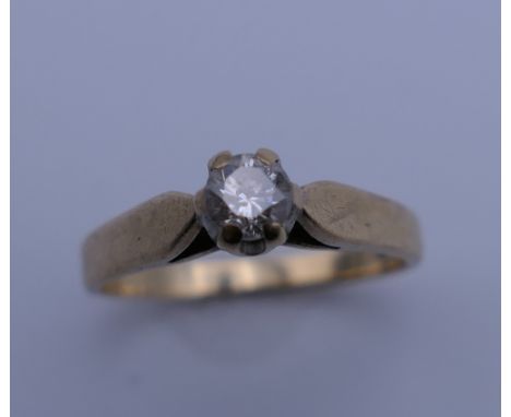 A 9 ct gold diamond solitaire ring. Ring size K/L. 2 grammes total weight.