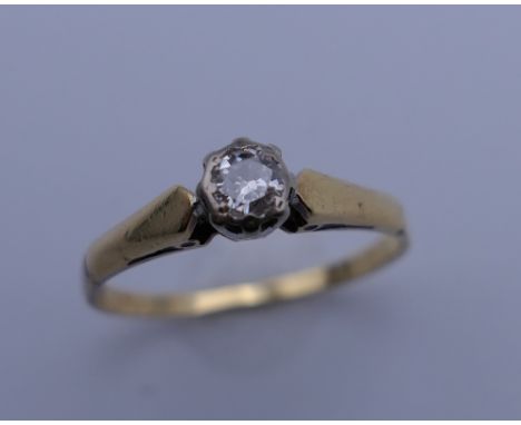 An 18 ct gold diamond solitaire ring. Ring size N. 2.2 grammes total weight.