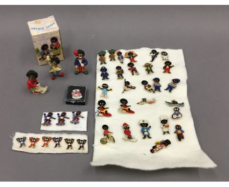 A large collection of Golly pin badges including vintage ones and Golly ornaments.