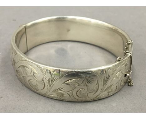 A silver bangle form bracelet. 7 cm wide. 48.5 grammes.