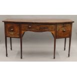 A 19th century mahogany inlaid bow front sideboard. 178 cm wide.