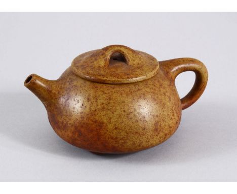 AN UNUSUAL CHINESE YIXING TEAPOT, with marks to inner lid and impressed seal mark to base, 16cm at widest point, 8.5cm high.