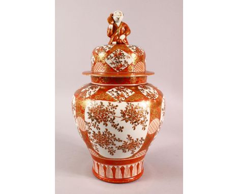 A LARGE JAPANESE KUTANI BALUSTER SHAPED VASE AND COVER, the cover with finial modelled as a seated figure, decorated all over