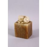 A GOOD CHINESE SOAPSTONE CARVING in the form of a dog of fo, 8cm high.