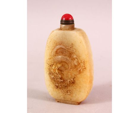 A CHINESE CARVED WHITE JADE SNUFF BOTTLE, carved with a dragon and horses, 8.5cm high