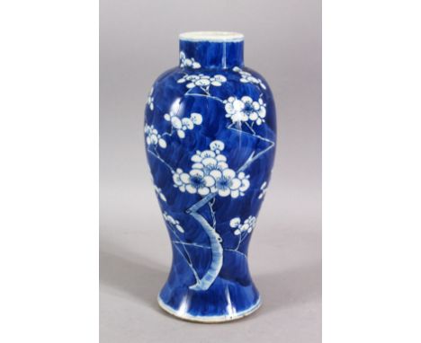 A 19TH CENTURY CHINESE BLUE &amp; WHITE PORCELAIN PRUNUS VASE - decorated with a blue ground and with prunus decoration - the