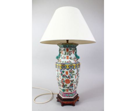 A 19TH / 20TH CENTURY CHINESE FAMILLE ROSE PORCELAIN VASE / LAMP, the body of the vase decorated with scenes of fruit and goo