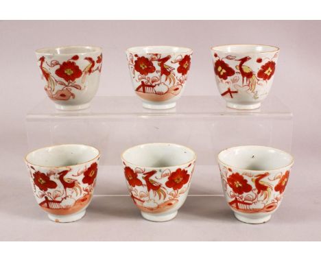 A SET OF SIX ARITA PORCELAIN CUPS, each painted with iron red bird amongst flowers, each approx. 7cm high.
