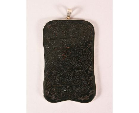 A RARE AND FINE INDO PERSIAN LARGE ENGRAVED SPINACH JADE PENDANT with silver mounts, engraved with text, 11cm x 7cm.