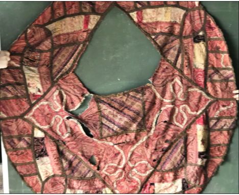 AN EARLY EMBROIDERED PONCHO OR SHAWL, later converted to pouffe cover, approx 4ft 9in x 4ft 3in.