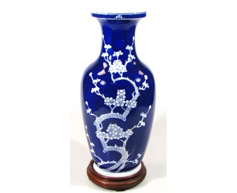 A late Qing period Chinese porcelain prunus vase, the shouldered body with compressed trumpet stem, typically decorated with 