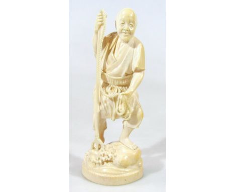 A Japanese late Meiji period ivory figure, of a gentleman holding a trident on naturalistic oval base, flowerhead and letter 