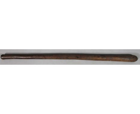 A Maori hardwood club, of cylindrical tapering outline sparsely decorated with a repeat print geometric pattern, 112cm wide. 