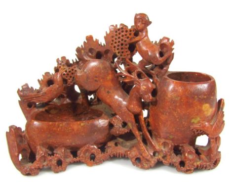 A 20thC Chinese soapstone figure group, with rutting stag flanked by two open bowls, on a naturalistic setting set with birds