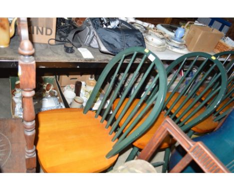 A set of four stick back beech dining chairs 