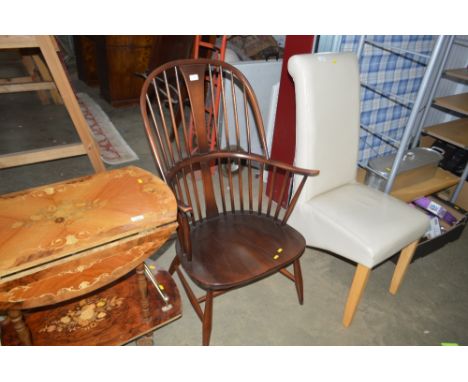 An Ercol stick back arm chair
