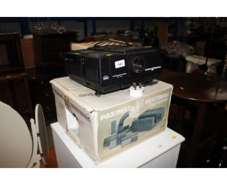 A Braun slide projector with original box 