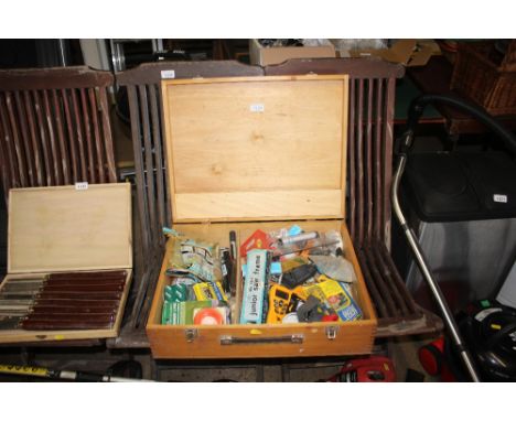 A wooden tool box and contents of various tools and sundry items 