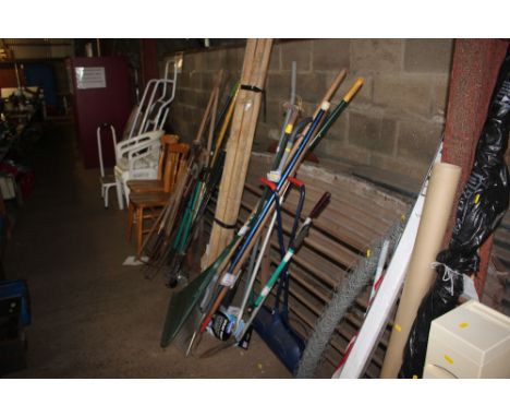 A quantity of long handled gardening tools 