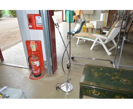 A chrome floor standing light