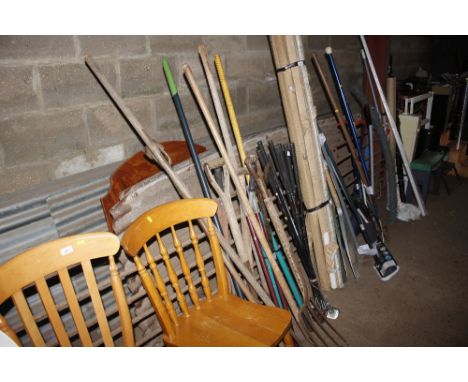 A quantity of long handled gardening tools