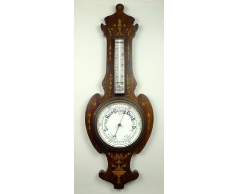 A Victorian rosewood and inlaid wheel barometer, with thermometer, the case inlaid with ribbons and harebells, 86cm long.