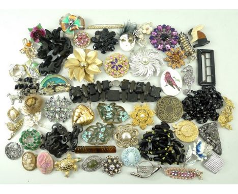 A quantity of costume jewellery including enamel Art Nouveau floral buckles converted to brooches, French jet jewellery, earr