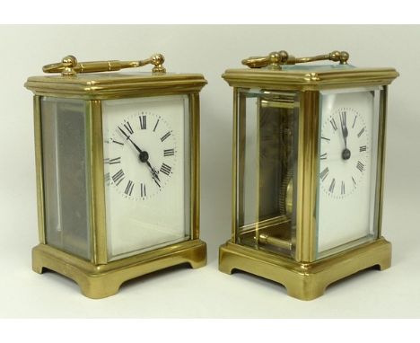 A brass cased carriage clock, enamel dial bearing Roman numerals, single barrel movement, 8 by 6 by 12cm, and a further brass