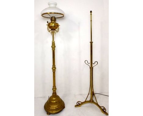 Two brass 19th century standard lamps, one a converted paraffin lamp stand and the other art nouveau, 158cm and 149cm high.