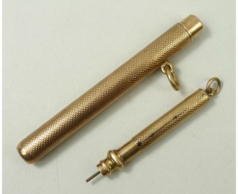 A 9ct gold propelling pencil with engine turned decoration, and another similar pencil, Arthur Downing Ltd, Birmingham 1904, 