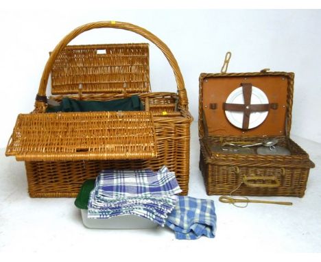 A wicker picnic hamper, circa 1910, with fittings, and a later wicker picnic basket/hamper, 41 by 59 by 52cm high. (2)