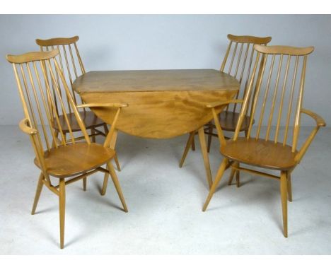 An Ercol drop leaf table and four stick back dining chairs with solid elm seats, 113 by 63 by 66cm high. 