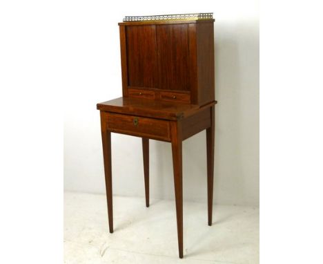 A satinwood and cross banded tambour fronted bonheur de jour, circa 1800, with a pierced brass gallery over tambour sliding d