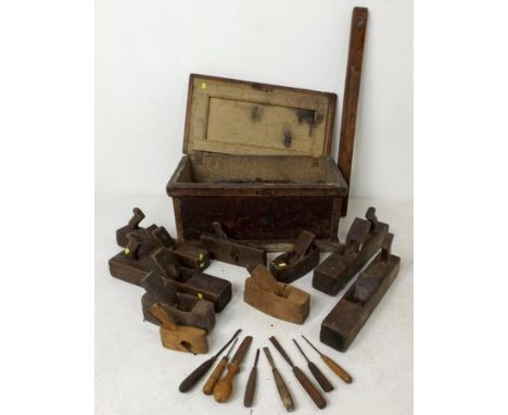A pine box comprising a collection of tools, planes and moulding planes, 60 by 32 by 28cm high. 