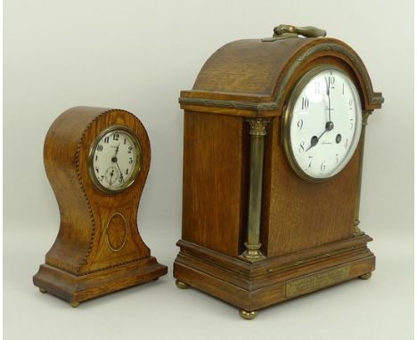 An oak cased mantel clock, early 20th century, by Gerard, Aberdeen, with brass pillars, white enamel dial bearing Arabic nume