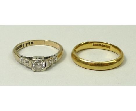 A 22ct gold wedding band, 3.5g, size I, and a 9ct gold and paste solitaire ring, size K. 