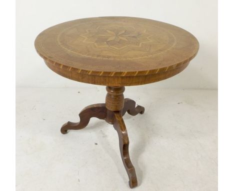 An 18th century parquetry table, inlaid with a starburst, raised on a tripod base, 60 by 60 by 55cm high. 