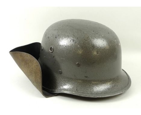 A German fireman's steel helmet. 