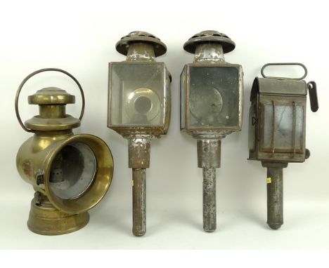 A pair of Victorian tin carriage lamps, 45cm high, a further carriage lamp, 34cm high, and a Lucas King of the Road brass car