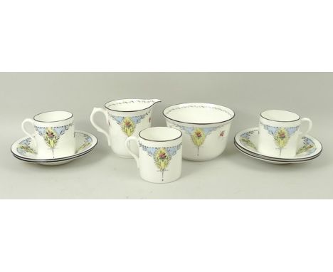 A Shelley porcelain part coffee service printed with fruit, pattern no 11560, comprising cream jug, sugar bowl, three cans an