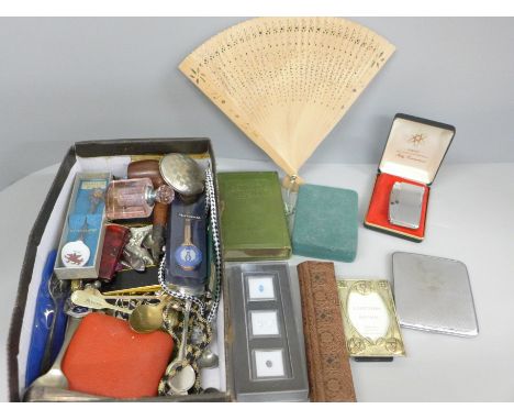 A box of assorted items, lighters, pipe, scent bottle, fan, gemstones, etc. 