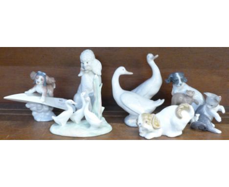 Two Lladro figures and six Nao figures, two with small chips 